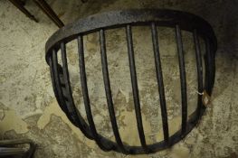 A large wrought iron hay manger.