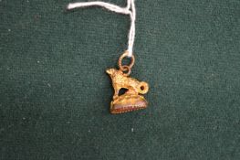 A small fob seal modelled as a dog.