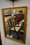 A small gilt framed mirror.