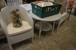 Modern pair of lloyd loom armchairs with matching two-tier table.
