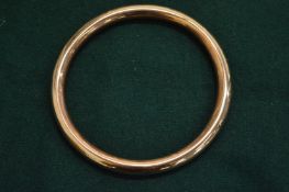 A 9ct gold hollow bangle, approx 12grams.