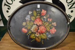 A floral decorated Toleware tray.