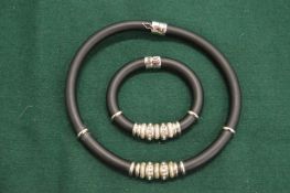 A decorative necklace and matching bracelet.