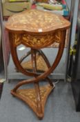 A French style marquetry pedestal table with a single drawer on curving supports.