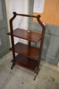 Mahogany folding three-tier stand.