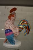 A Herend cockerel, in red fishnet pattern, 23cm high.