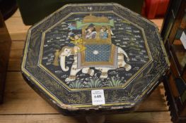 A small Indian lacquer table or stand decorated with an elephant and riders a howdah.