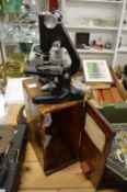 A cased microscope.