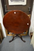 A 19th century mahogany circular tilt-top tripod table.