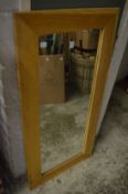 An oak framed mirror.