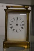A brass carriage clock.