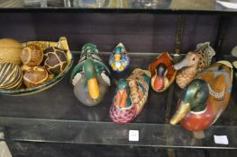 Colourfully painted wooden ducks etc.