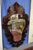 An unusual Venetian style large faux tortoiseshell framed mirror.
