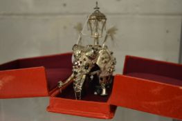 An Indian white metal mounted model of a parade elephant.