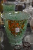 A Monart speckled green glazed vase.