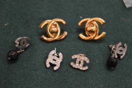 Three pairs of Chanel ear studs.