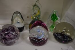 A group of six glass paperweights by Mdina, Caithness etc.