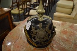 A Prussian brass and leather helmet.