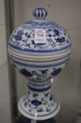 A Chinese blue and white pedestal bowl and cover.