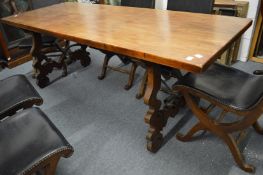 A good Spanish baroque style walnut dining table with wrought iron stretchers.