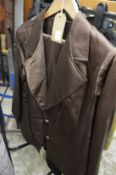 A ladies brown sateen jacket and trousers.