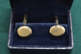A pair of 9ct gold cufflinks, boxed.