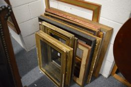 A collection of picture frames, various mediums and sizes.