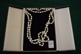A cased pearl necklace.