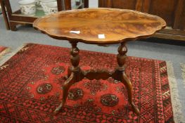 A mahogany occasional table.