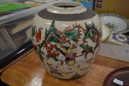 A large Chinese crackle glazed jar decorated with warriors.