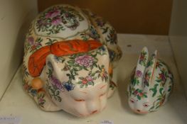 A Chinese style famille rose pottery cat and similar rabbit.