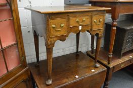 An 18th century oak low boy (alterations and repairs).