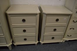 A good pair of cream painted three drawer bedside chests.