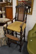 An 18th century style oak high chair.