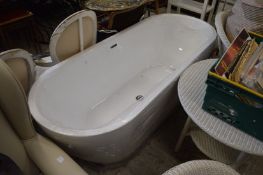 A modern bath (appears unused).