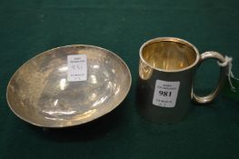 A silver Christening tankard and a hammered silver bowl.