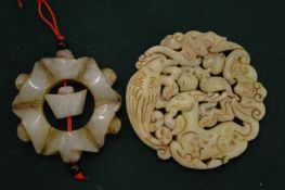 Two Chinese carved jade pendants.