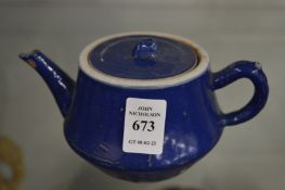 A small Chinese blue glazed teapot.