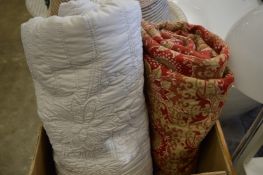 Two bed covers or throws.