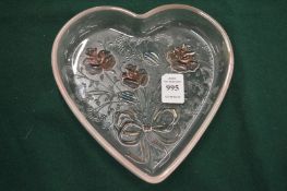A moulded heart shaped glass dish.
