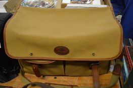 A Melvill and Moon leather and canvas holdall.