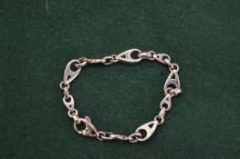 A silver Tiffany child's bracelet.