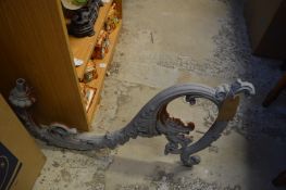 A large cast iron lantern bracket and various parts.