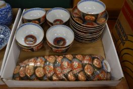 A collection of Japanese Imari decorated bowls with covers and stands.