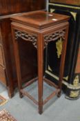 A Chinese hardwood vase stand.