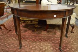 A 19th century mahogany demi-lune side table.