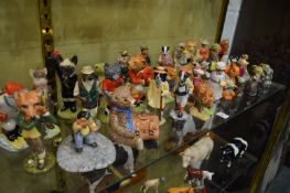 A good large collection of Beswick and other caricature animals carrying out various pursuits.