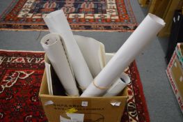 A group of unframed prints.