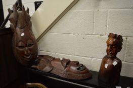 Carved African hardwood bust and two wall masks.