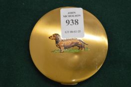 Ladies compact, the cover decorated with a dachshund.